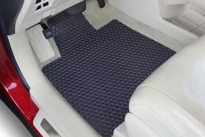 A heathered carpet mat installed on a vehicle’s floor